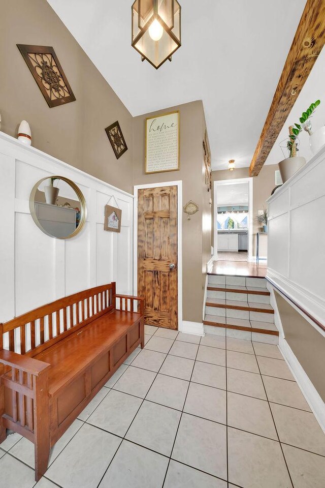 5640 W 82nd Pl, Burbank, IL 60459 - mudroom featuring a decorative wall, light tile patterned floors, and a wainscoted wall
