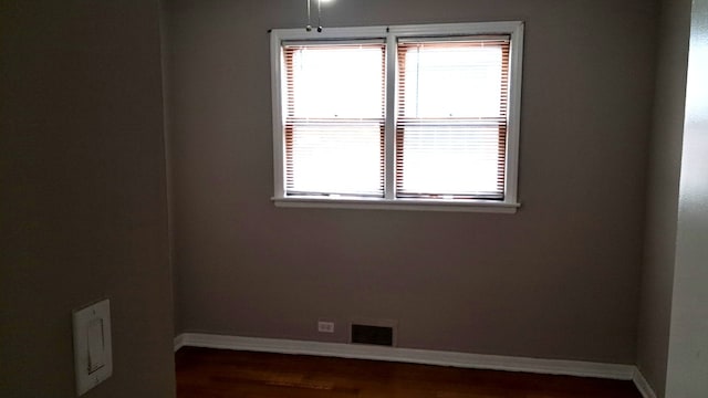 4542 S Lamon Ave, Chicago, IL 60638 - unfurnished room with baseboards and wood finished floors