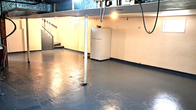 4542 S Lamon Ave, Chicago, IL 60638 - below grade area featuring freestanding refrigerator, stairway, and baseboards