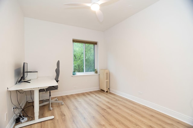 932 W Sunnyside Ave Unit 1C, Chicago, IL 60640 - office area with radiator, wood finished floors, baseboards, and ceiling fan