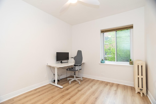932 W Sunnyside Ave Unit 1C, Chicago, IL 60640 - home office featuring radiator heating unit, wood finished floors, baseboards, and ceiling fan