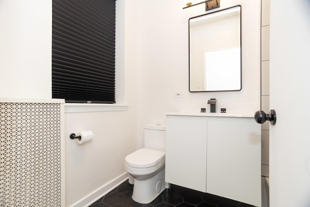 932 W Sunnyside Ave Unit 1C, Chicago, IL 60640 - bathroom with vanity, toilet, tile patterned floors, and baseboards