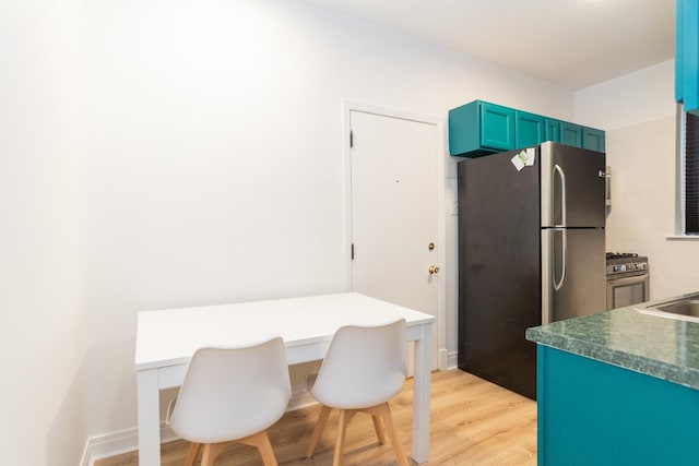 932 W Sunnyside Ave Unit 1C, Chicago, IL 60640 - dining area with light wood-style floors and an office area