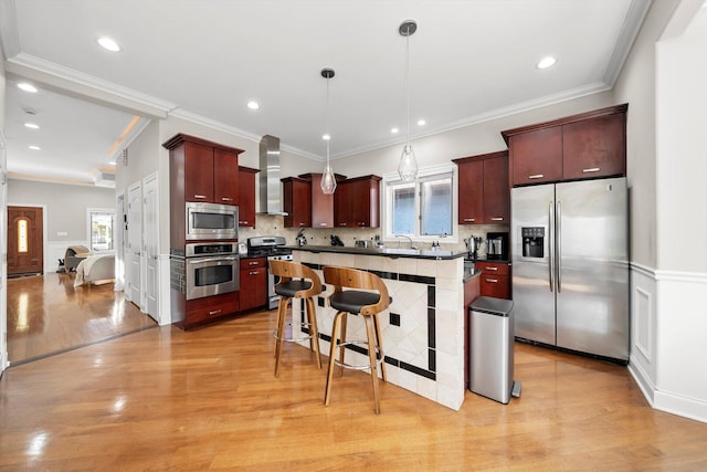 6205 W Grace St, Chicago, IL 60634 - kitchen featuring appliances with stainless steel finishes, wall chimney range hood, healthy amount of natural light, a sink, and crown molding