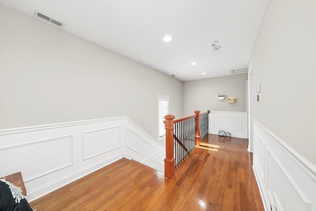 6205 W Grace St, Chicago, IL 60634 - hall featuring an upstairs landing, a decorative wall, light wood-style flooring, wainscoting, and recessed lighting