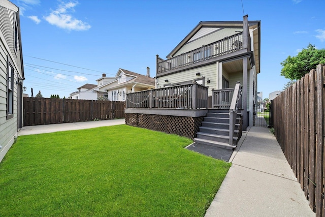 6205 W Grace St, Chicago, IL 60634 - back of property with a balcony, a wooden deck, and a patio area