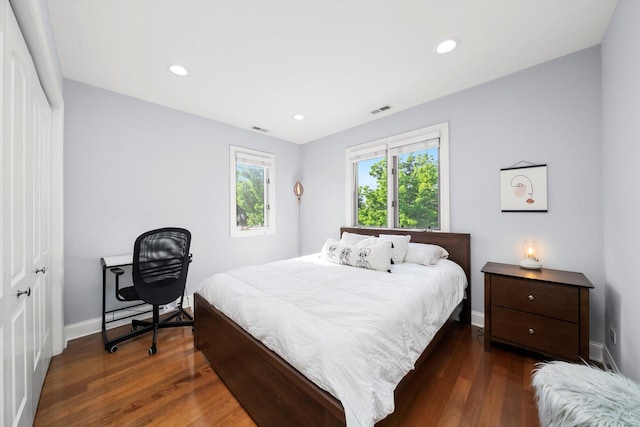 6205 W Grace St, Chicago, IL 60634 - bedroom featuring baseboards, dark wood-type flooring, and recessed lighting