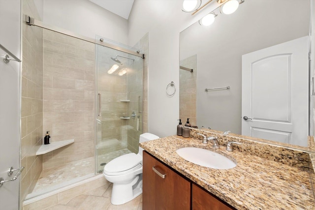6205 W Grace St, Chicago, IL 60634 - bathroom with a shower stall, vanity, toilet, and tile patterned flooring