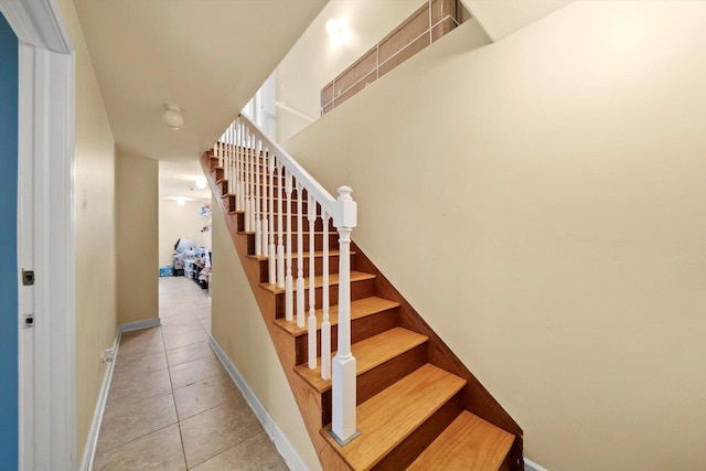 6205 W Grace St, Chicago, IL 60634 - stairs featuring tile patterned floors and baseboards