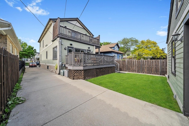 6205 W Grace St, Chicago, IL 60634 - rear view of property featuring a balcony, a deck, and a patio area