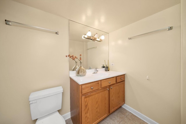 6205 W Grace St, Chicago, IL 60634 - bathroom with vanity, tile patterned floors, toilet, and baseboards