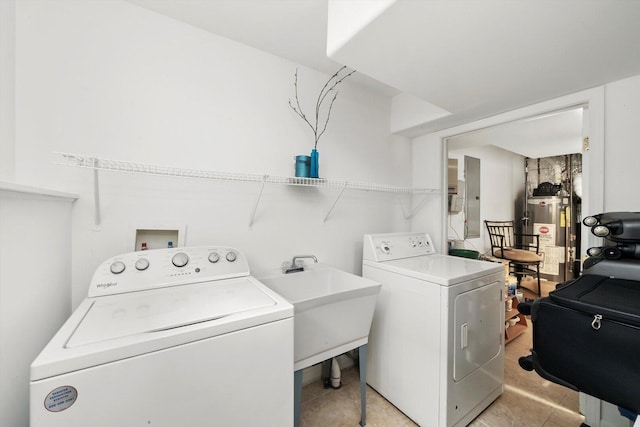 6205 W Grace St, Chicago, IL 60634 - laundry area featuring gas water heater, washing machine and clothes dryer, and light tile patterned floors