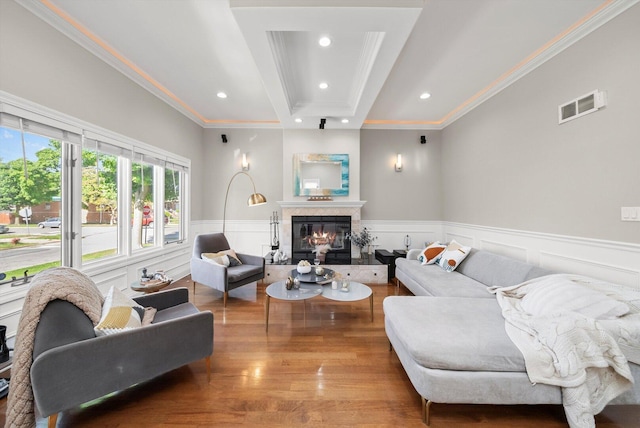 6205 W Grace St, Chicago, IL 60634 - living room featuring recessed lighting, wood finished floors, crown molding, a glass covered fireplace, and a wainscoted wall