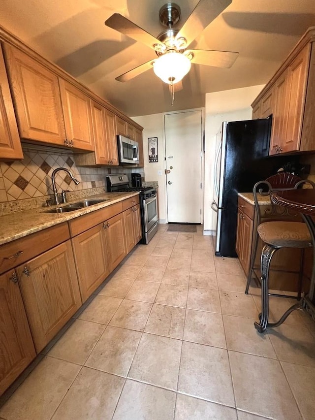 6700 S S Shore Dr Unit 17A, Chicago, IL 60649 - kitchen featuring appliances with stainless steel finishes, a sink, decorative backsplash, and light tile patterned flooring