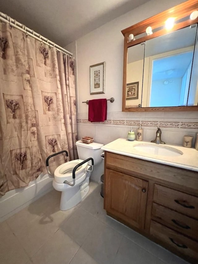 6700 S S Shore Dr Unit 17A, Chicago, IL 60649 - bathroom featuring toilet, tile patterned flooring, vanity, tile walls, and shower / tub combo