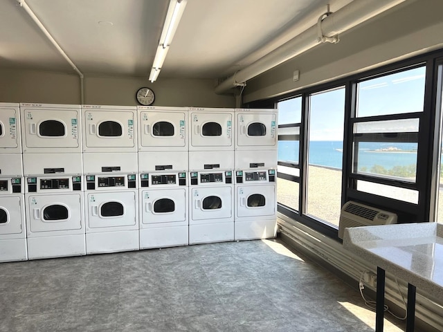 6700 S S Shore Dr Unit 17A, Chicago, IL 60649 - communal laundry room featuring stacked washing machine and dryer, independent washer and dryer, and healthy amount of natural light