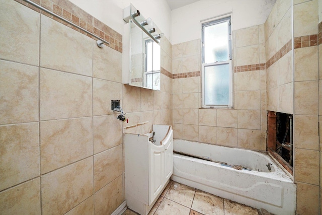 6146 S Morgan St, Chicago, IL 60621 - bathroom featuring tile walls, plenty of natural light, and washtub / shower combination