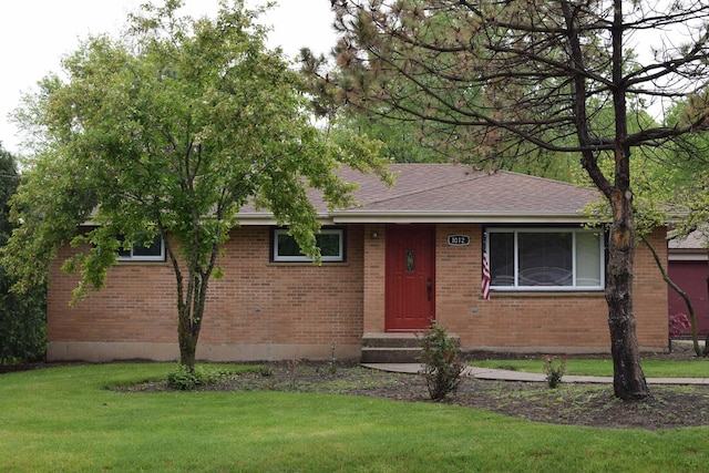 1012 Elsie Ave, Gurnee, IL 60031 - view of front of house with a front lawn, brick siding, and a shingled roof