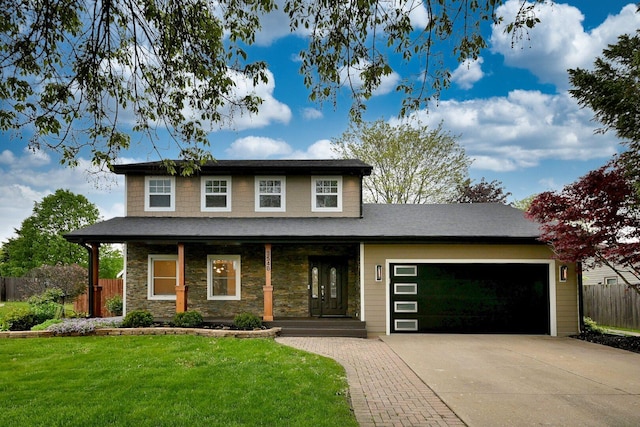 3548 Grandmore Ave, Gurnee, IL 60031 - view of front of property with a garage, covered porch, driveway, and stone siding