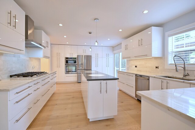 3548 Grandmore Ave, Gurnee, IL 60031 - kitchen with appliances with stainless steel finishes, modern cabinets, wall chimney exhaust hood, a sink, and recessed lighting