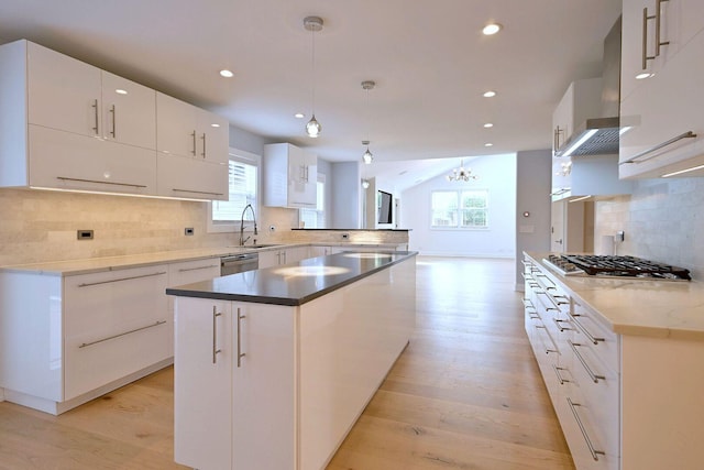 3548 Grandmore Ave, Gurnee, IL 60031 - kitchen featuring appliances with stainless steel finishes, light wood-style floors, decorative backsplash, healthy amount of natural light, and recessed lighting