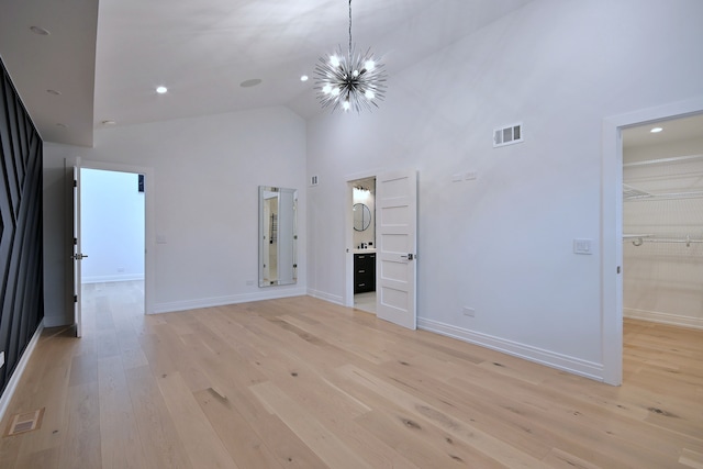 3548 Grandmore Ave, Gurnee, IL 60031 - unfurnished living room featuring high vaulted ceiling, baseboards, light wood finished floors, a chandelier, and recessed lighting