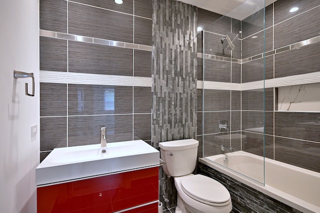 3548 Grandmore Ave, Gurnee, IL 60031 - bathroom with tile walls, tiled shower / bath, toilet, and vanity