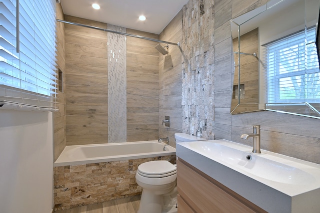 3548 Grandmore Ave, Gurnee, IL 60031 - bathroom featuring tiled shower / bath, toilet, vanity, and tile walls