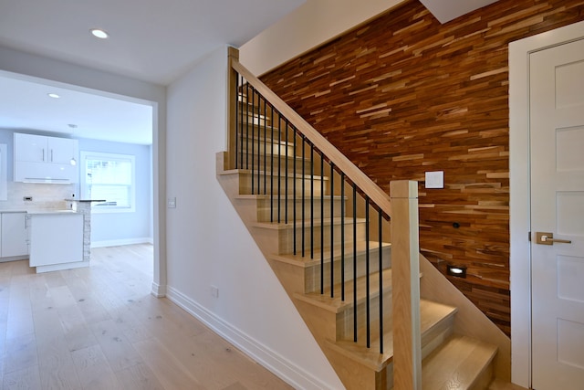 3548 Grandmore Ave, Gurnee, IL 60031 - stairway with baseboards, wooden walls, wood finished floors, and recessed lighting