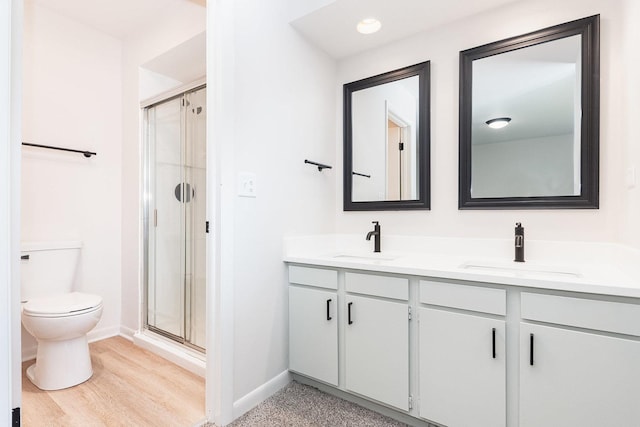 334 Ashland Ave, Highwood, IL 60040 - bathroom with double vanity, toilet, a shower stall, baseboards, and recessed lighting