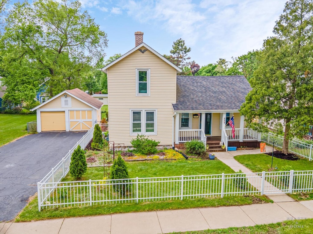 224 N Main St, Crystal Lake, IL 60014 - traditional-style house with an outbuilding, a porch, a chimney, a garage, and a shingled roof