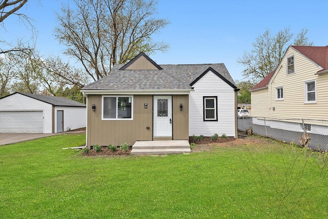 1326 N Poplar Ave, Round Lake Beach, IL 60073 - bungalow-style home with roof with shingles, a detached garage, and an outdoor structure