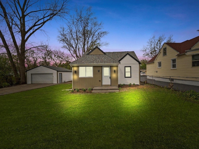 1326 N Poplar Ave, Round Lake Beach, IL 60073 - view of front of property with a garage, an outbuilding, and roof with shingles