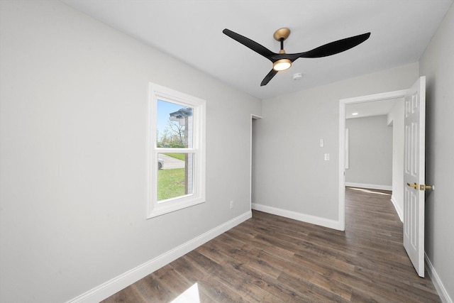 1326 N Poplar Ave, Round Lake Beach, IL 60073 - unfurnished room featuring dark wood-style flooring and a ceiling fan