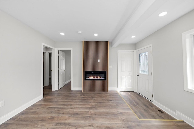 1326 N Poplar Ave, Round Lake Beach, IL 60073 - unfurnished living room featuring recessed lighting, a glass covered fireplace, and wood finished floors