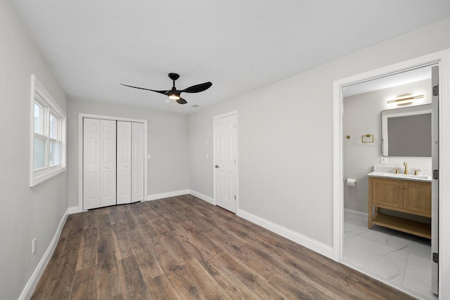 1326 N Poplar Ave, Round Lake Beach, IL 60073 - unfurnished bedroom featuring a closet, dark wood-style flooring, a ceiling fan, and ensuite bathroom
