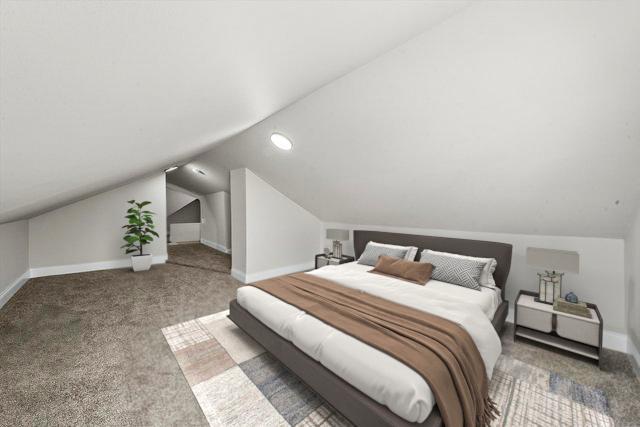 1326 N Poplar Ave, Round Lake Beach, IL 60073 - carpeted bedroom featuring lofted ceiling and baseboards