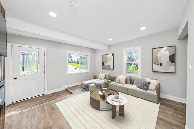 1326 N Poplar Ave, Round Lake Beach, IL 60073 - living room featuring healthy amount of natural light, wood finished floors, and recessed lighting