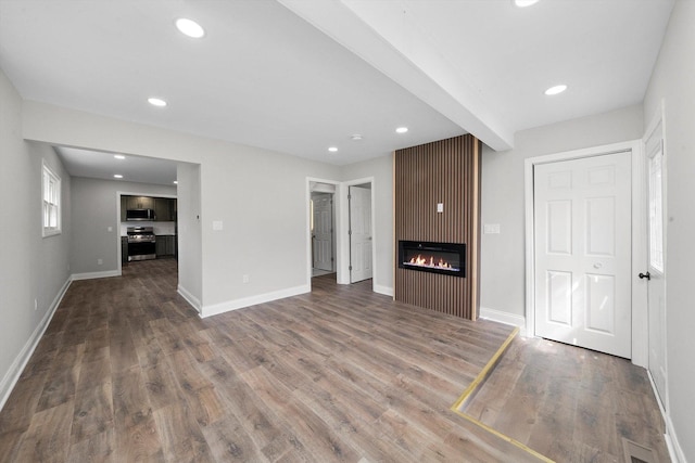 1326 N Poplar Ave, Round Lake Beach, IL 60073 - unfurnished living room with wood finished floors, a large fireplace, and recessed lighting