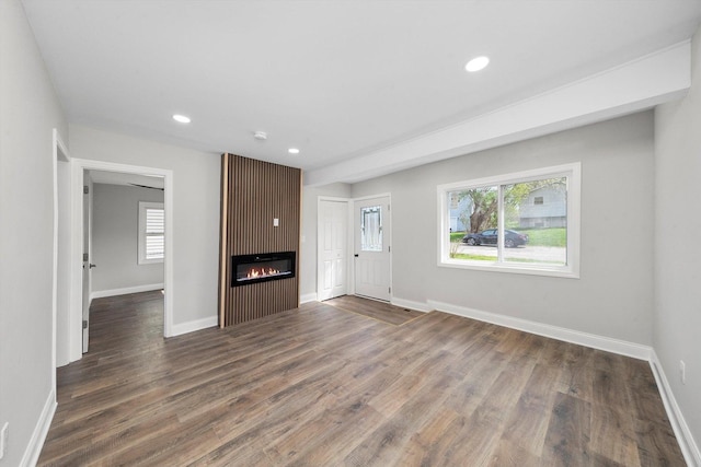 1326 N Poplar Ave, Round Lake Beach, IL 60073 - unfurnished living room with wood finished floors, recessed lighting, and a large fireplace