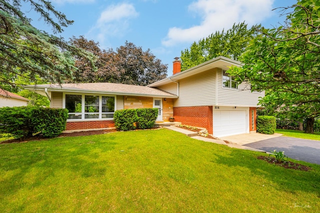 314 Oak Ave, Westmont, IL 60559 - split level home featuring brick siding, a chimney, driveway, and a front lawn