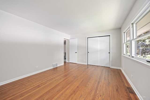 314 Oak Ave, Westmont, IL 60559 - unfurnished bedroom with light wood-style floors and a closet