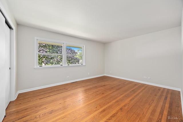 314 Oak Ave, Westmont, IL 60559 - unfurnished bedroom featuring a closet and light wood-style floors