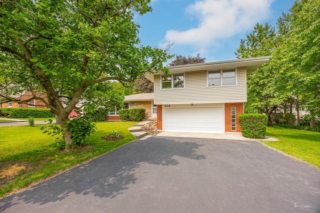 314 Oak Ave, Westmont, IL 60559 - view of front of property with driveway, brick siding, an attached garage, and a front yard
