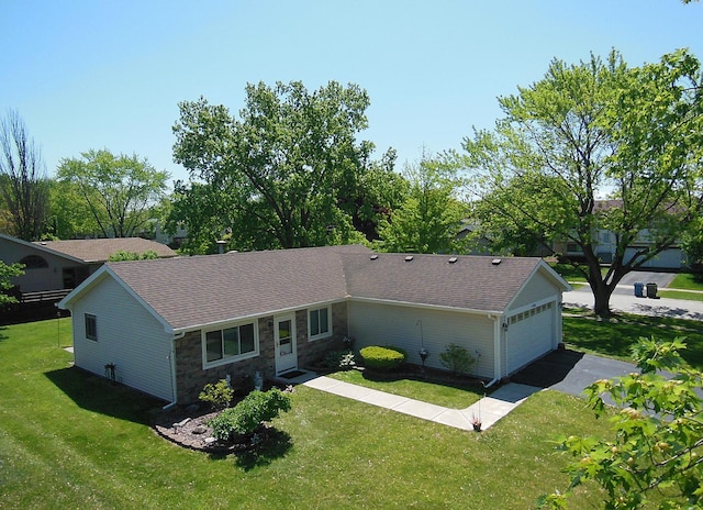 4585 Zeppelin Dr, Hanover Park, IL 60133 - single story home featuring stone siding, a front lawn, a detached garage, and roof with shingles