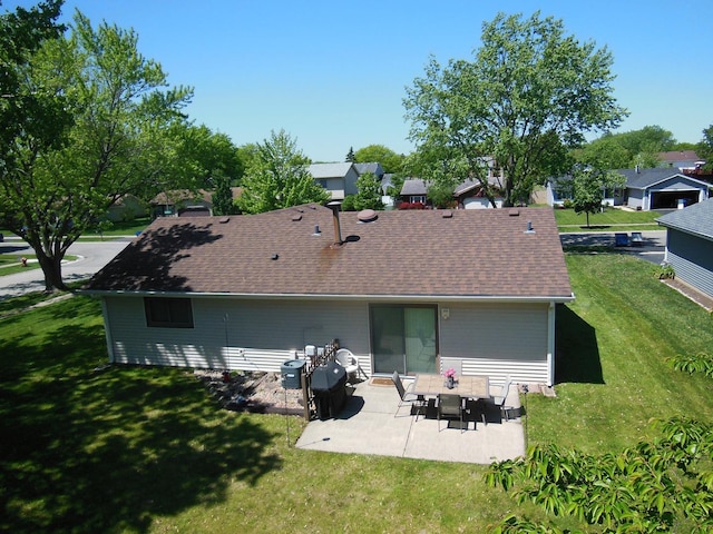 4585 Zeppelin Dr, Hanover Park, IL 60133 - rear view of property featuring a patio area, a lawn, and a shingled roof