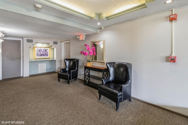 1106 S New Wilke Rd Unit 401, Arlington Heights, IL 60005 - living area featuring carpet floors, a textured ceiling, and baseboards