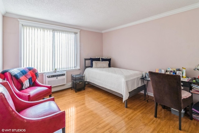 1106 S New Wilke Rd Unit 401, Arlington Heights, IL 60005 - bedroom with wood finished floors, a textured ceiling, ornamental molding, a wall mounted AC, and a baseboard heating unit