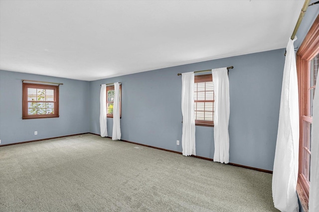 2107 Barberry Dr, Champaign, IL 61821 - carpeted spare room featuring baseboards