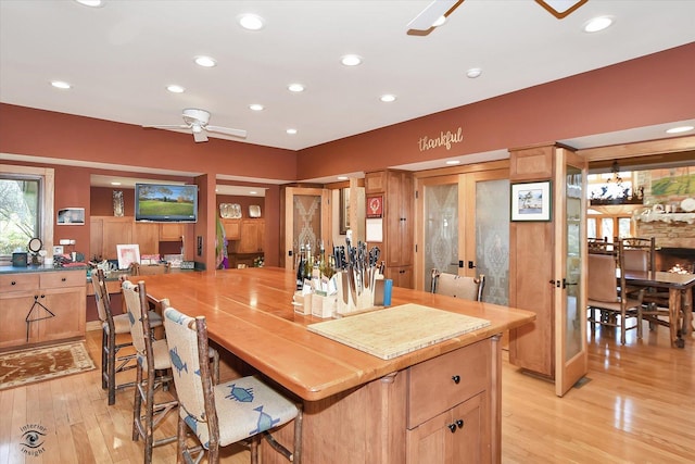 4776A W State Route 102, Bourbonnais, IL 60914 - kitchen featuring light wood-style flooring, recessed lighting, a breakfast bar area, ceiling fan, and french doors